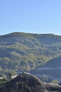 Scenic view of mountains against clear blue sky