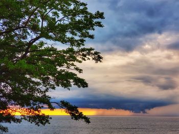 Scenic view of sea against sky at sunset