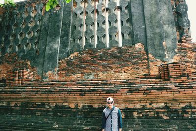 Man standing outside historic temple