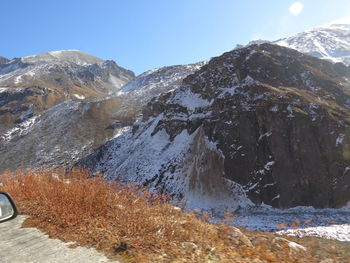 Scenic view of snowcapped mountains against clear sky