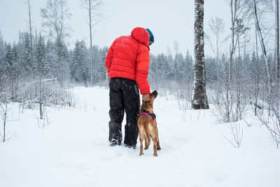 Dog on snow covered field