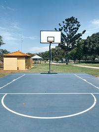 View of basketball court against blue sky