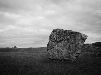 Scenic view of landscape against cloudy sky