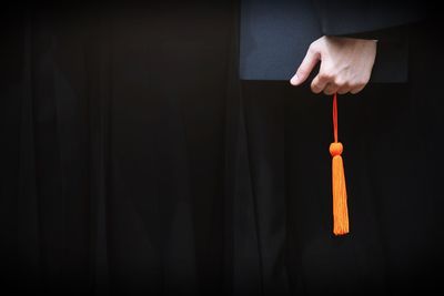 Close-up of hand holding lighting equipment