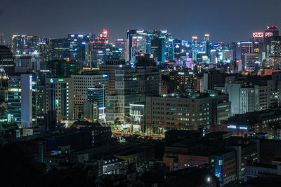 Illuminated buildings in city at night