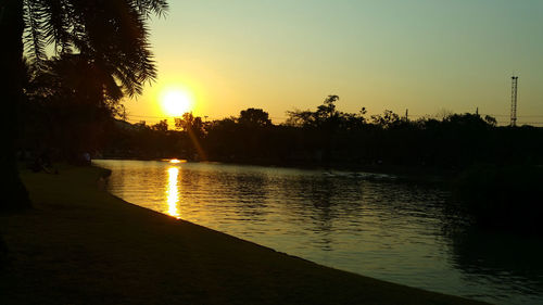 Scenic view of lake against sky during sunset