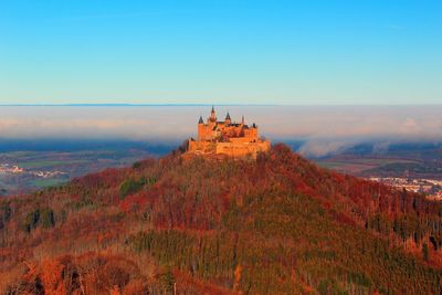 Scenic view of land against sky during autumn