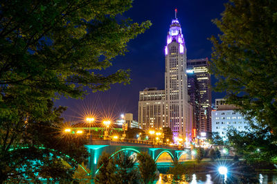 Low angle view of illuminated buildings at night