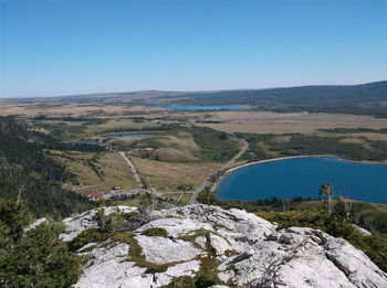 Scenic view of mountains against clear blue sky