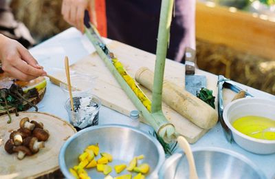 Close-up of man preparing food on cutting board