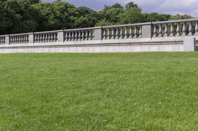 View of bridge on field against trees