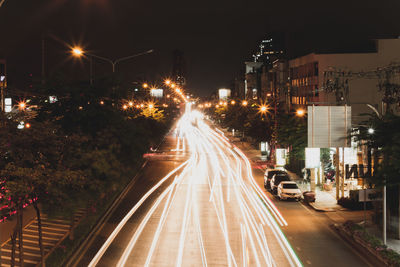 Light trails on street in city at night