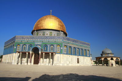 View of historical building against clear blue sky