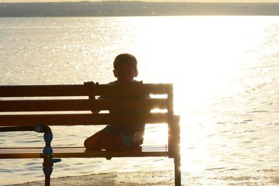 Rear view of boy looking at sea