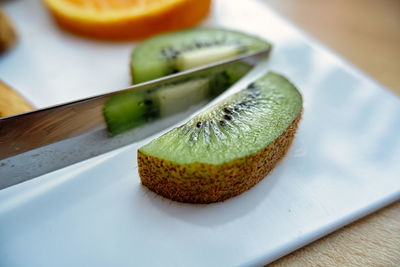 Close-up of fruits in plate on table