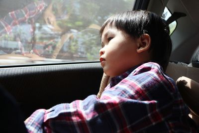 Boy sitting in car