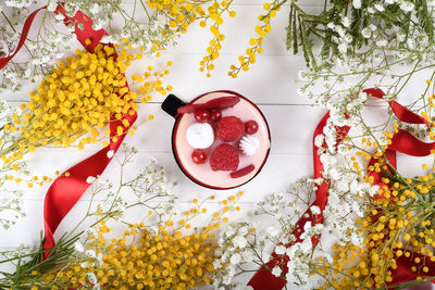 High angle view of red roses on table