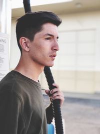 Side view of young man looking away