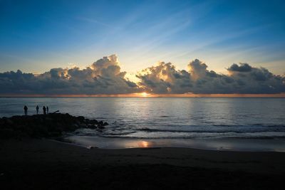 Scenic view of sea against sky at sunset