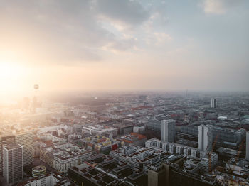 High angle view of buildings against sky during sunset