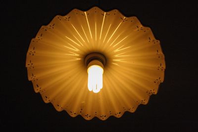 Low angle view of illuminated lighting equipment