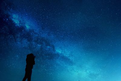 Full length of man against star field at night