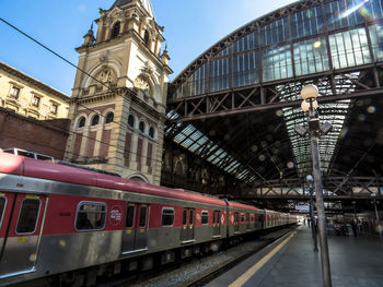 Train on railroad station platform in city