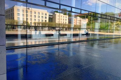 Building reflecting in water