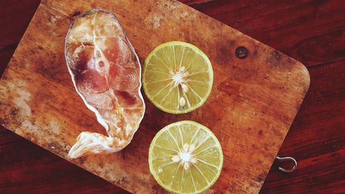 High angle view of lemon slice on cutting board