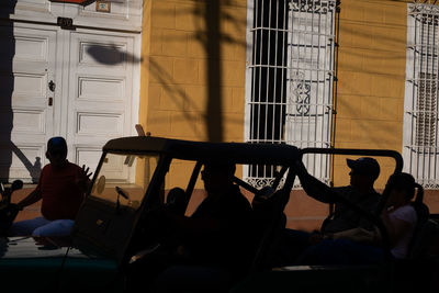 People sitting outside building