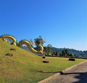 View of sculpture against clear blue sky