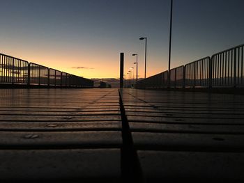 View of suspension bridge against sky during sunset