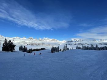 Scenic view of snowcapped mountains against sky