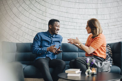 Young couple sitting on sofa