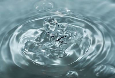 High angle view of drop falling in water