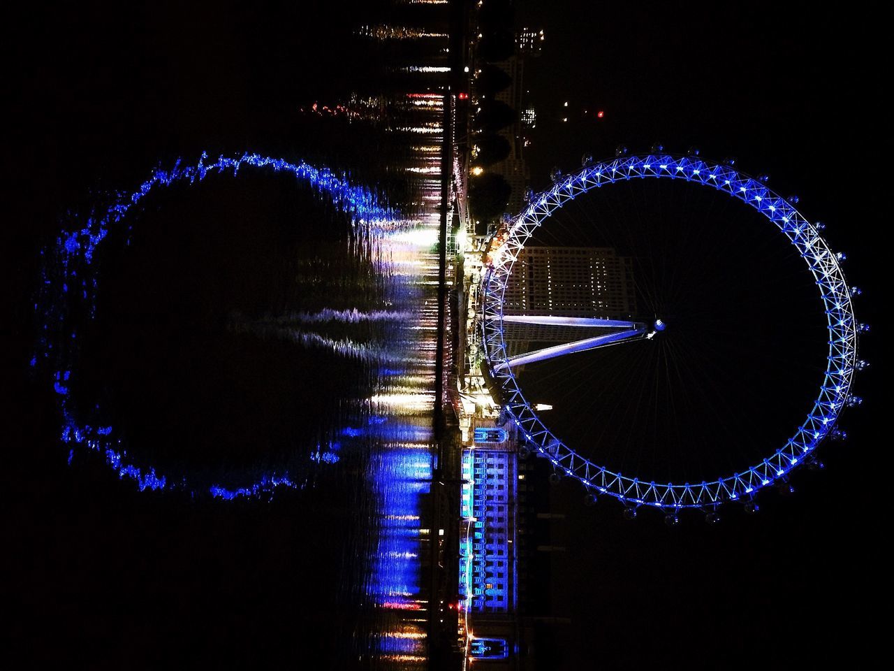 VIEW OF ILLUMINATED LIGHTS AT NIGHT