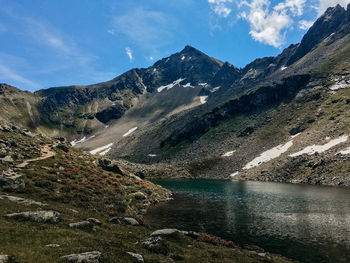 Scenic view of lake and mountains against sky