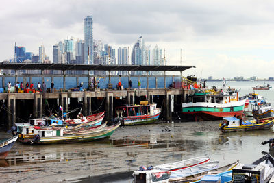 Boats moored at harbor