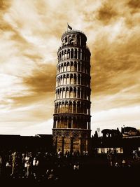 Low angle view of building against cloudy sky