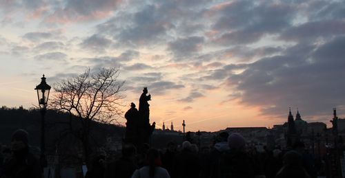 Silhouette of people at sunset