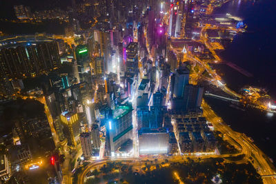 High angle view of city lit up at night