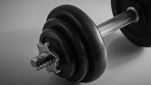 Close-up of dumbbells against black background