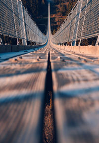 Tilt-shift image of suspension bridge in city