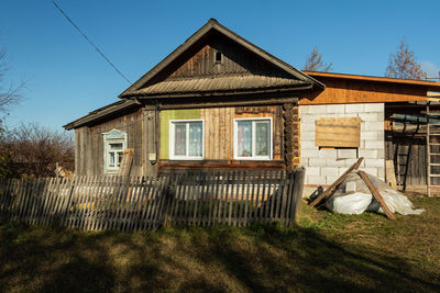 House on field against sky