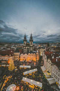 Aerial view of illuminated buildings in city