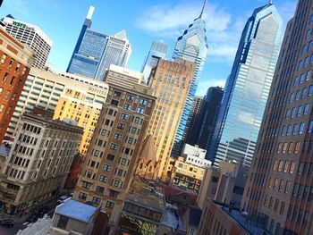 Low angle view of buildings against sky in city