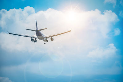 Low angle view of airplane flying in sky