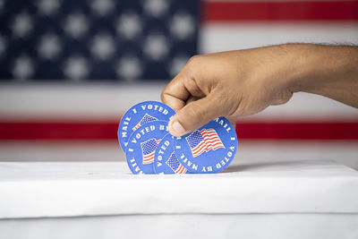 Close-up of hand holding flag