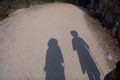 Shadow of people on sand