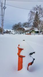 Snow covered landscape against sky